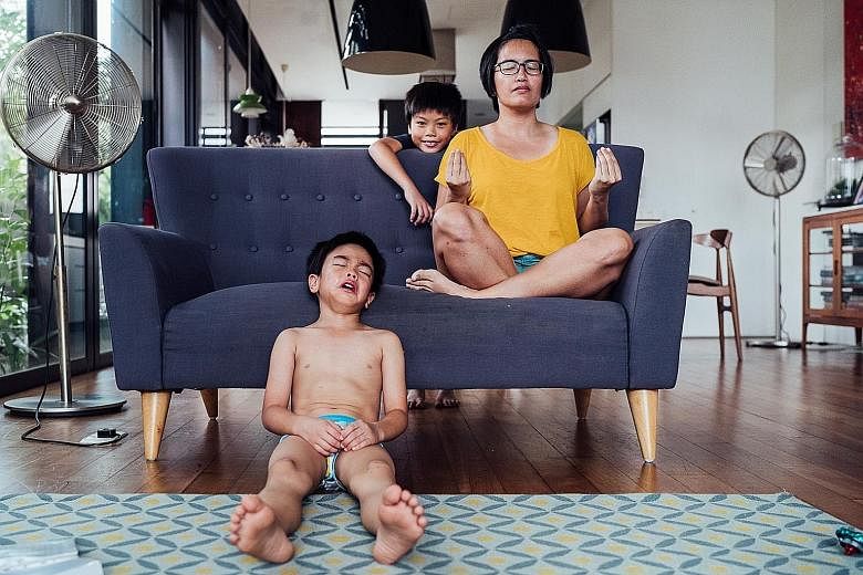 Photographer Kerry Cheah (above, with her sons) could not work during the circuit breaker, so she kept herself engaged by taking photos of her sons, and working on a series of self-portraits. 