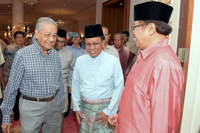 A June 2018 file photo of then Malaysian Prime Minister Mahathir Mohamad, Sabah Chief Minister Shafie Apdal (centre) and Sarawak Chief Minister Abang Johari Tun Openg (right) at an event in Putrajaya. Dr Mahathir said yesterday that Pakatan Harapan P