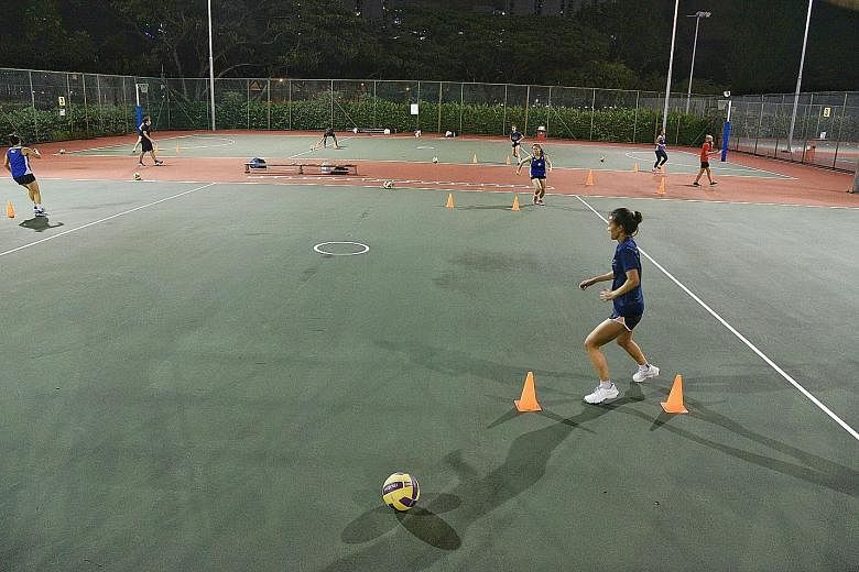 The national netball teams resuming training at the Kallang Netball Centre last Tuesday. The 24 members of the Open and A-teams were split into groups and occupied six courts for their first court session in over two months. 