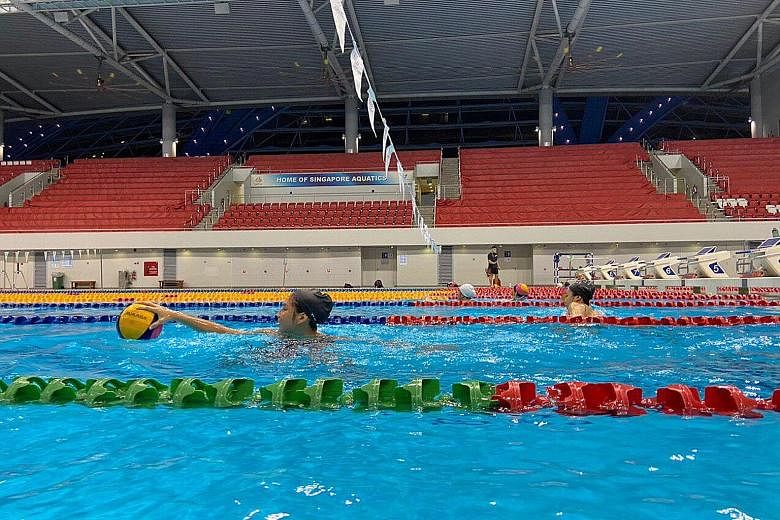 The national water polo teams training at the OCBC Aquatic Centre last Monday. There were lane ropes dividing each lane, so that each player had his/her own lane and ball to practise his/her individual drills. 