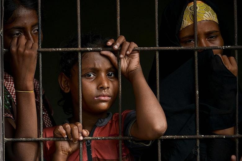 Rohingya at an immigration detention centre in Lhokseumawe, Indonesia, last Friday. The bedraggled survivors of a four-month journey at sea - about 100 in all, mostly women and children - were rescued by fishermen in Indonesia last Wednesday.