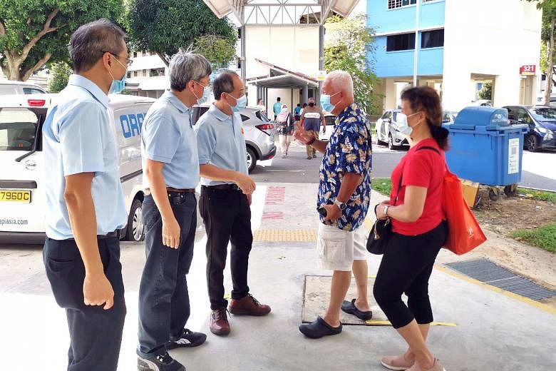 Prime Minister Lee Hsien Loong joined Mr Henry Kwek (at left) on a walkabout yesterday at Mayflower Market and Food Centre. Mr Kwek is an incumbent MP for Nee Soon GRC, in charge of Kebun Baru, which is now a single seat. Former Workers' Party (WP) c