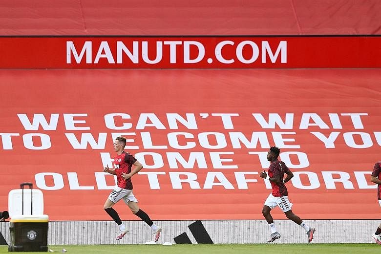 Manchester United players Scott McTominay, Fred and Juan Mata warming up for a match at Old Trafford. The Red Devils resume their push for a top-four place in the Premier League with an away game at Brighton today. PHOTO: REUTERS