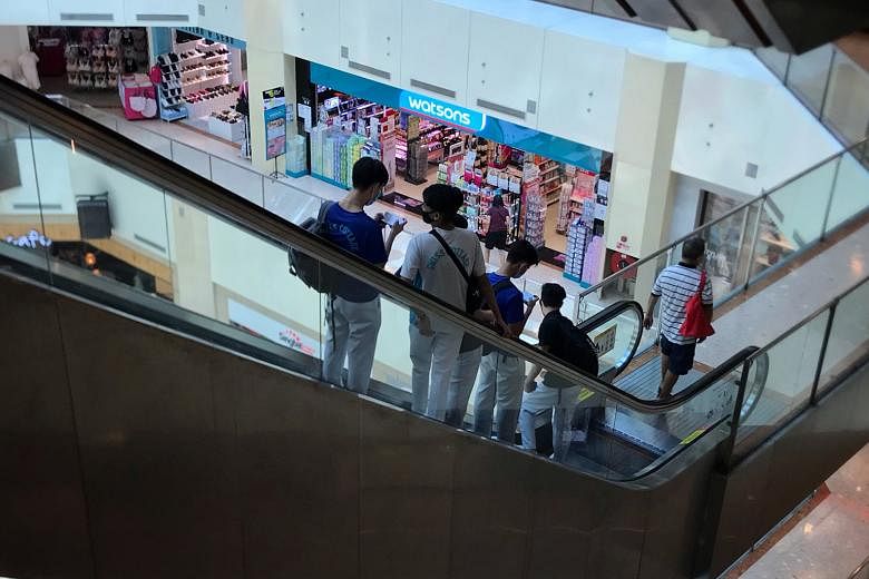 From left: Students at a McDonald's outlet in Bukit Batok Central, hanging out at Tiong Bahru Plaza and West Mall in Bukit Batok. ST PHOTOS: CHONG JUN LIANG, JASON QUAH