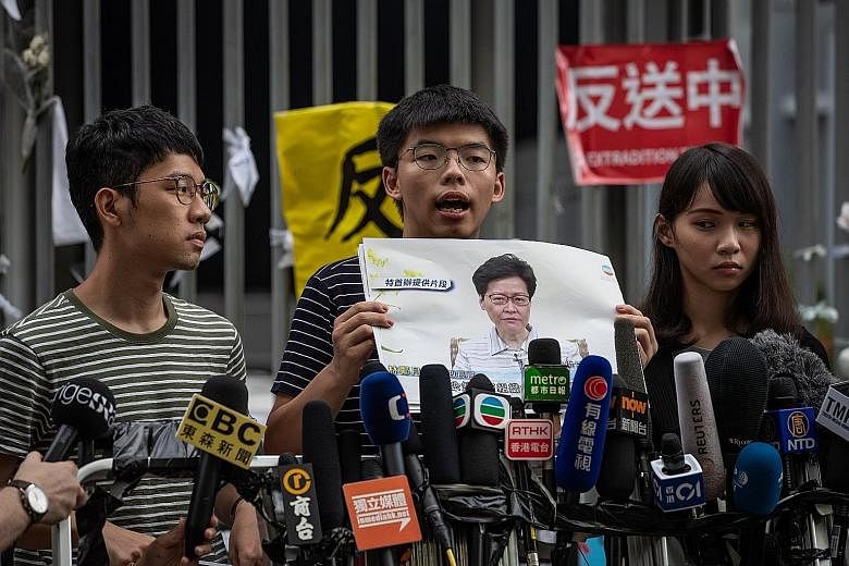 A file photo from June last year showing activists (from left) Nathan Law, Joshua Wong and Agnes Chow. The trio yesterday announced their resignations from the pro-democracy group Demosisto.