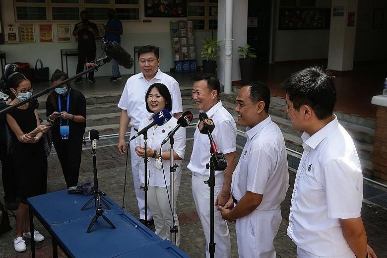 Workers' Party chief Pritam Singh and chairman Sylvia Lim speaking to the media with fellow Aljunied GRC candidates (from left) Leon Perera, Faisal Manap and Gerald Giam at Deyi Secondary School yesterday. The WP has fielded its strongest slate in th