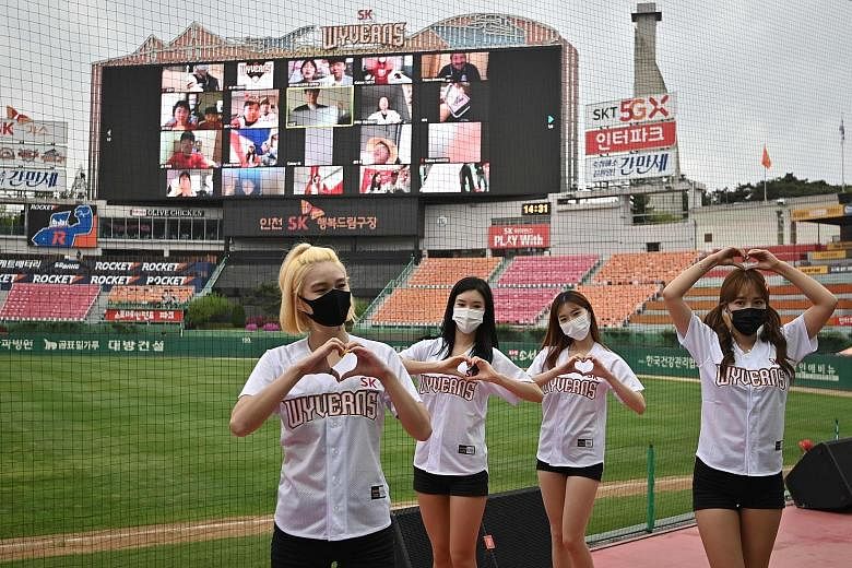 Cheerleaders at a game in Incheon on May 5, when South Korean baseball action resumed behind closed doors. Fans, who have been cheering from home over the past two months, are expected to return in limited numbers some time this month. PHOTO: AGENCE 