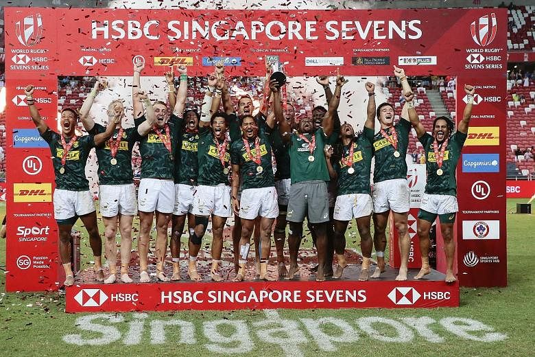 South Africa rugby sevens players celebrating after edging out Fiji 20-19 in last year's Singapore final at the National Stadium. They will not get to defend their title till next April. PHOTO: EPA-EFE
