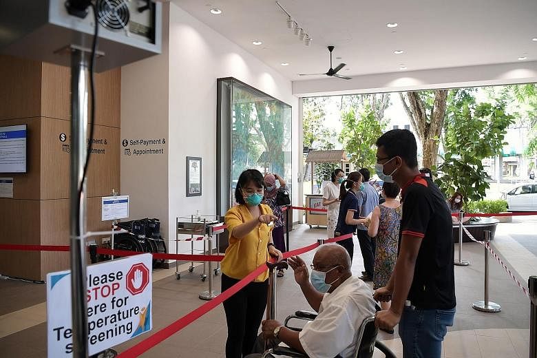 The triage area of Ang Mo Kio Polyclinic in February. Healthcare professionals cited possible reasons for the fewer cases of acute respiratory infection during the circuit breaker period, including the effective measures imposed by the Government and