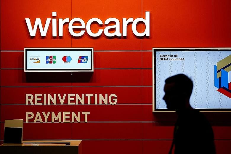 Wirecard's German parent filed for insolvency last week, after a €1.9 billion (S$2.97 billion) hole was found in its accounts. In Singapore, a criminal probe into the company began last year. PHOTO: REUTERS