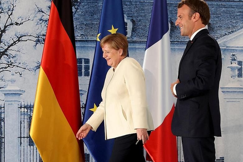 German Chancellor Angela Merkel and French President Emmanuel Macron at Meseberg Castle, the German federal government's guest house, after a joint press conference on Monday where they pushed for a coronavirus recovery fund to be financed by shared 