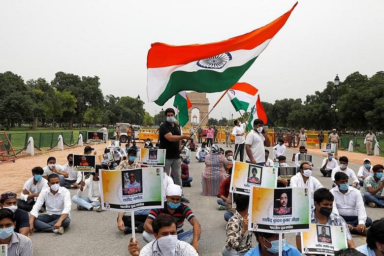 Supporters of India's main opposition Congress party in New Delhi last Friday paying tribute to Indian soldiers killed in the border clash with Chinese troops. The violent clash has seen tensions impact bilateral economic ties.