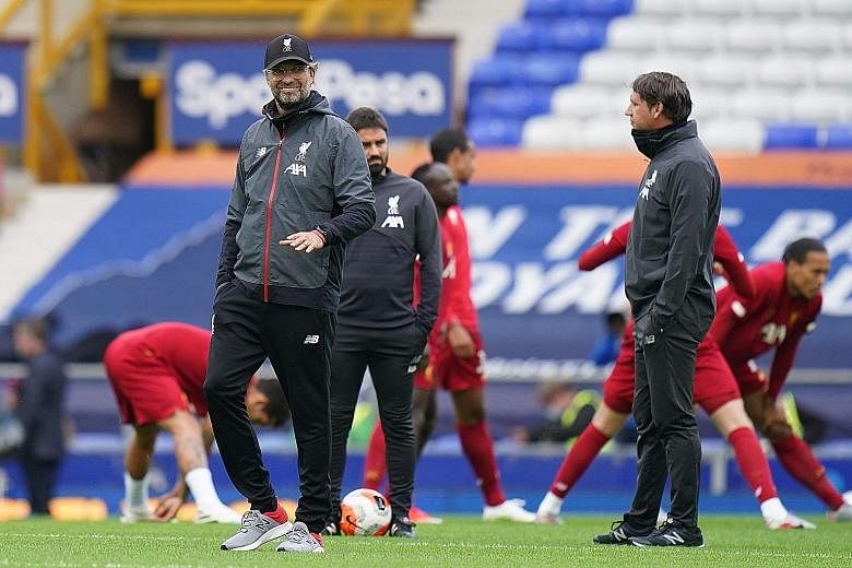 Liverpool's German manager Jurgen Klopp overseeing the warm-up before their match against Everton at Goodison Park on June 21. The Reds won the league with seven games to spare - a record.