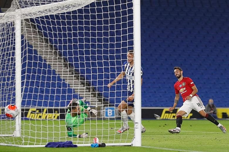 Manchester United midfielder Bruno Fernandes scoring his second goal past Brighton goalkeeper Mathew Ryan in Tuesday's Premier League game. The Portugal international is confident United will finish in the top four.