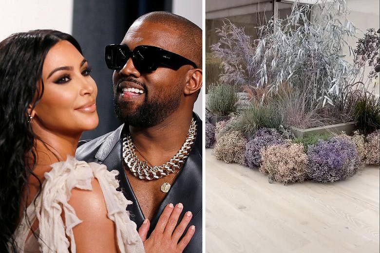 BATHROOM OF BLOOMS FOR BILLIONAIRE WIFE: American rapper Kanye West surprised his wife Kim Kardashian (both right) on Tuesday morning by decking their bathroom with fresh flowers (left), People.com reported. 	Kardashian, 39, posted a video on Instagr
