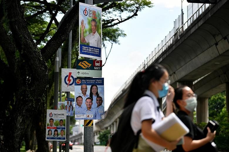 People's Action Party and Workers' Party election campaign posters for East Coast GRC. In tackling Singapore's challenges, we should prefer contesting candidates to offer hope and practical action, says the writer.