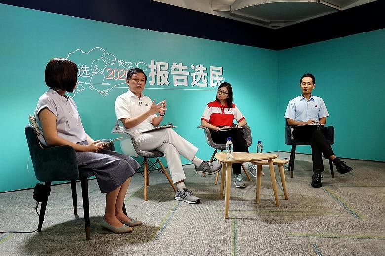 Minister for Trade and Industry Chan Chun Sing (second from left), Progress Singapore Party's Hazel Poa and Workers' Party's Kenneth Foo in online Mandarin talk show Face The Voters. The moderator is Ms Ang Yiting (extreme left), the news editor of C