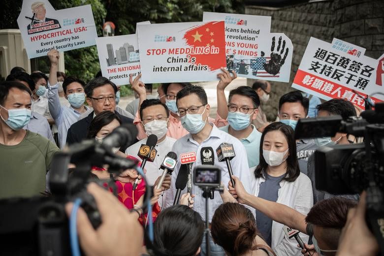 Mr Stanley Ng Chau-pei, Hong Kong deputy to the National People's Congress, speaking to the media during a demonstration to deliver a petition against "American and foreign meddling in China's internal affairs" to the US consulate in Hong Kong yester