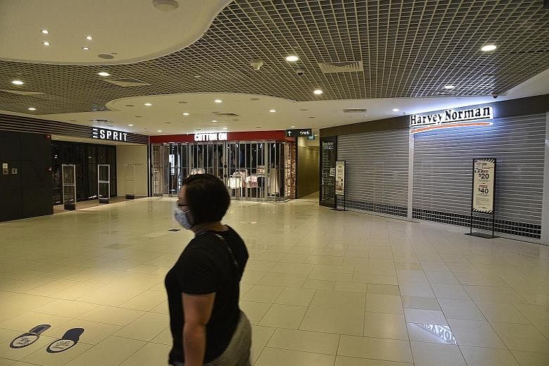 A near-empty Parkway Parade mall with most of its shops closed in May amid Singapore's circuit breaker. Retail sales that month suffered their biggest year-on-year fall since record-keeping began in 1986. Like in April, only two categories of retail sales