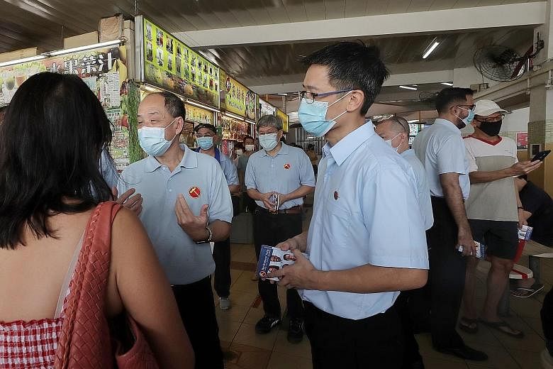 Reform Party's Mr Charles Yeo, who is standing in Ang Mo Kio GRC, sharing his views at NUSS' Pre-GE Forum yesterday. ST PHOTO: DESMOND WEE Singapore People's Party's Mr Steve Chia, who is contesting Bishan-Toa Payoh GRC, distributing fliers at Toa Pa