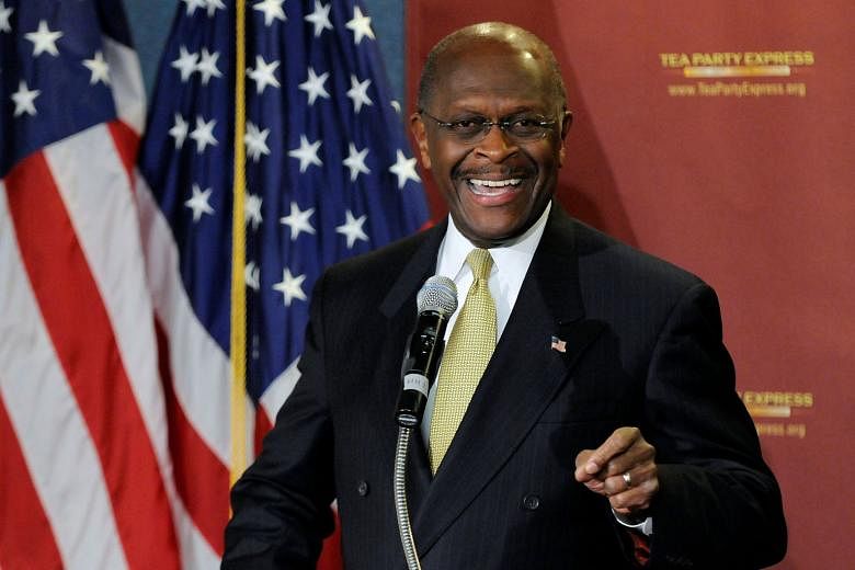 Republican Herman Cain in a January 2012 photo. He was at last month's rally in Tulsa, Oklahoma, for President Donald Trump, and later posted a photo of himself with Trump supporters - all without masks. PHOTO: REUTERS