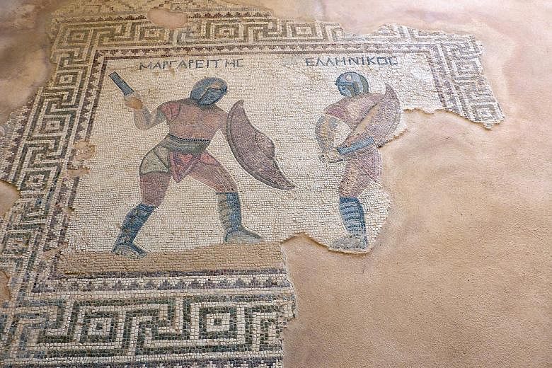 A third-century Roman mosaic of two gladiators in combat in the House of Gladiators in Kourion.