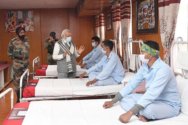 India's Prime Minister Narendra Modi visiting an army hospital in Ladakh on Friday. Ladakh was the scene of deadly clashes between Indian and Chinese troops last month. PHOTO: REUTERS