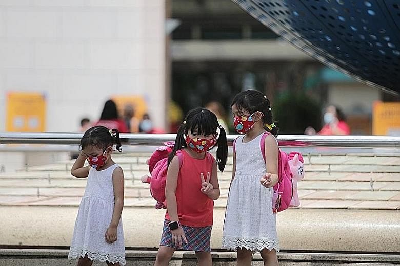 Children outside Universal Studios Singapore yesterday. A steady stream of visitors was seen entering the attraction when The Sunday Times visited. Visitors outside the S.E.A. Aquarium in Sentosa yesterday. A visitor said she was not worried about sa