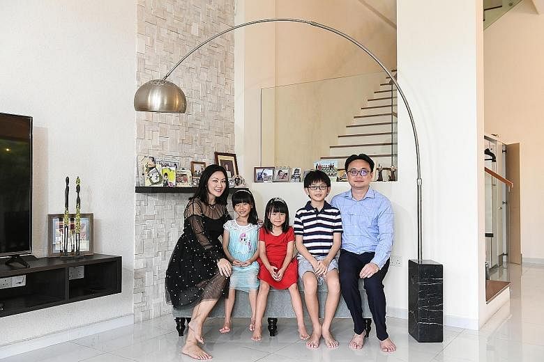 Cushman & Wakefield research head Christine Li with her husband, orthopaedic surgeon Chew Chee Ping, 40, and children Genevieve (in blue), seven, Gwendolyn, five, and Lucas, 10. Their Serangoon Gardens corner terrace house has a land size of 2,800 sq ft a