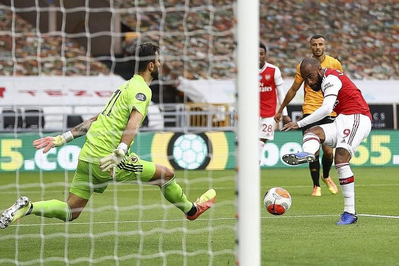 Alexandre Lacazette scoring past goalkeeper Rui Patricio to seal the 2-0 win at Molineux.
