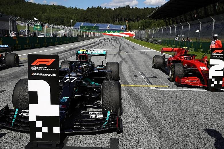 Bottas' Mercedes parked near the podium after winning the race in front of deserted stands at the Red Bull Ring as Formula One began behind closed doors without the usual fanfare and big crowds. 