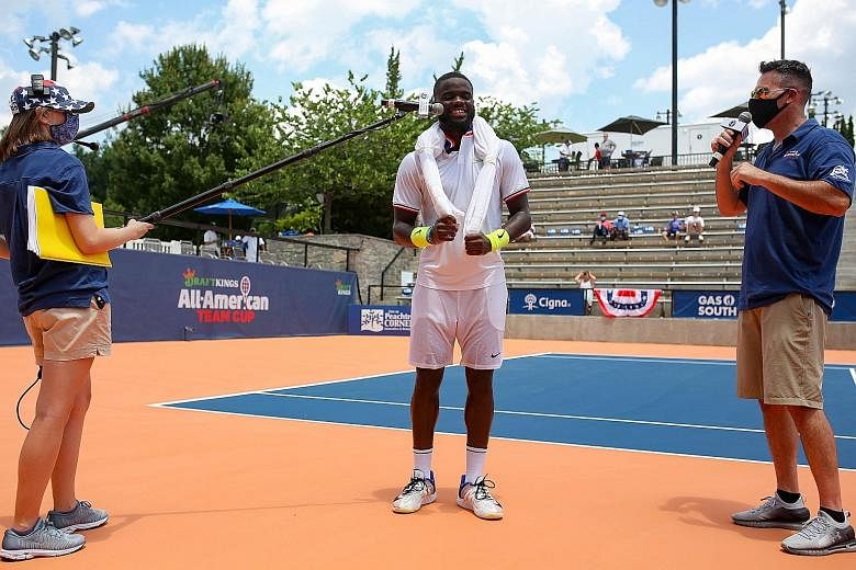 Frances Tiafoe observing social distancing in an interview after his win over Sam Querrey at the All-American Team Cup on Friday in Atlanta, Georgia. Later that day, he showed symptoms and tested positive. 