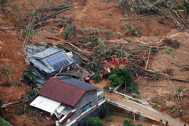 Rescue operations being carried out at a collapsed house in Ashikita town in Kumamoto prefecture, south-western Japan, on Saturday. PHOTO: EPA-EFE