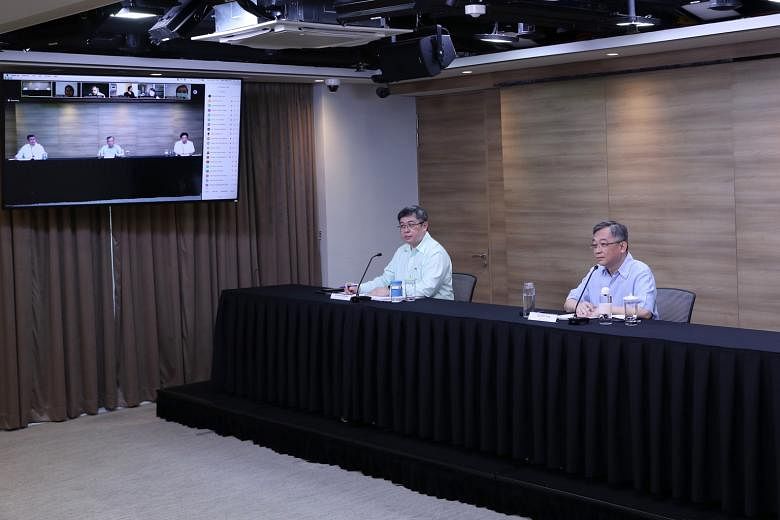 Singapore's top medical authority, the director of medical services at the Health Ministry, Associate Professor Kenneth Mak (far left), seen here with Health Minister Gan Kim Yong at a press conference last week on the Covid-19 pandemic. PHOTO: MINIS