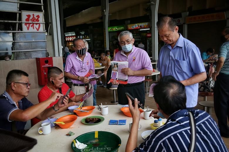 JALAN BESAR: Peoples Voice chief Lim Tean, who is leading his party's team in the GRC, speaking to patrons at Golden Mile Food Centre last Friday. MARINE PARADE:PAP candidates (from left) Edwin Tong, Mohd Fahmi Aliman, Tan Chuan-Jin and Tan See Leng 