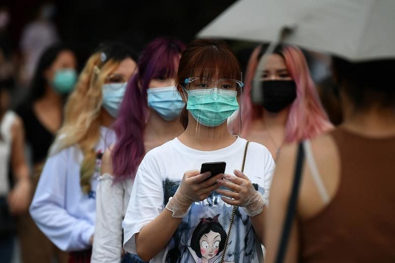 People out in Orchard Road on the first day of phase two of the reopening on June 19. The number of new infections in the community has increased to an average of 10 per day in the past week, from an average of seven cases per day in the week before 