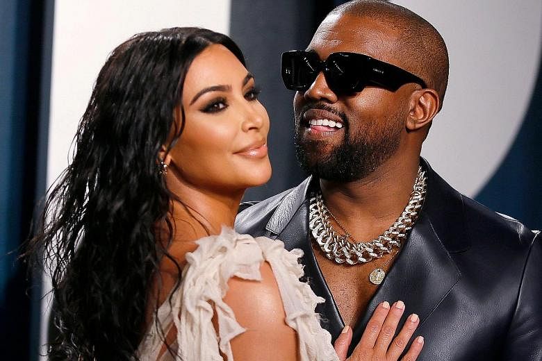 Rapper and fashion designer Kanye West (left) with his wife, reality-television star Kim Kardashian West. He had previously announced plans to run for president without doing so.