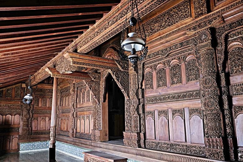 Gebyok typically features intricate floral and phoenix carvings in wall-sized partitions made of heavy teakwood. PHOTO: CHRISTIAN OCTIMURDANU