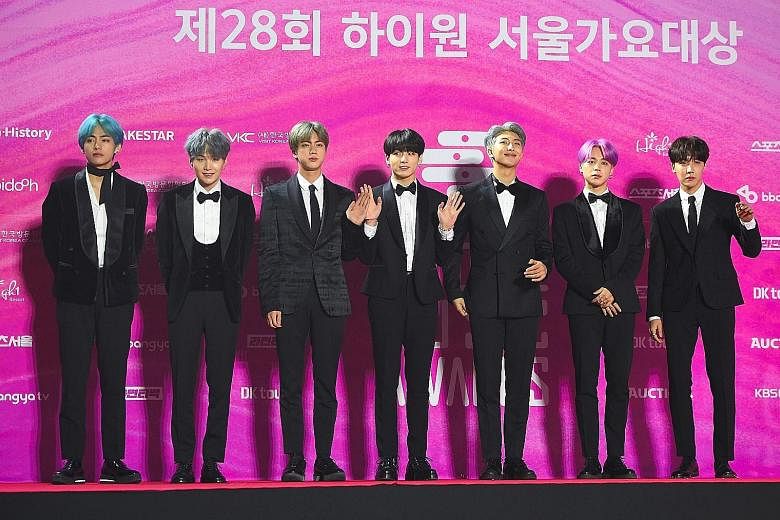 South Korean boy band BTS (left) on the red carpet at the 28th Seoul Music Awards in Seoul last year.