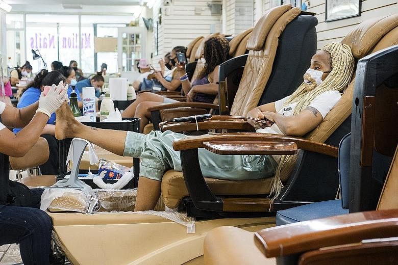 A nail salon in New York City on Monday, when such personal care services and some outdoor recreation activities were allowed to resume. Even so, the city's unemployment rate is hovering near 20 per cent, a figure not seen since the Great Depression.