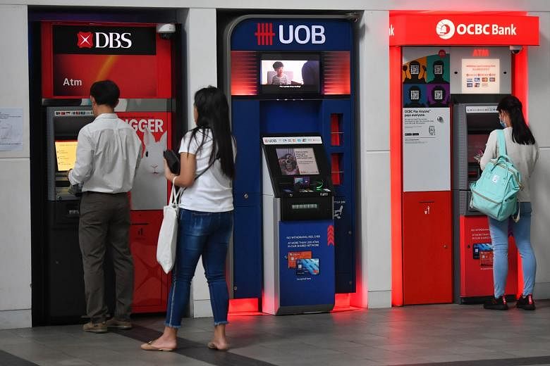 DBS, OCBC and UOB were placed on rating watch negative by Fitch Ratings in April, due in part to the impact of the coronavirus pandemic. ST FILE PHOTO