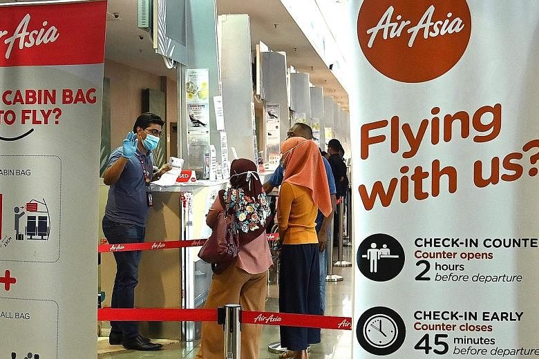 An AirAsia counter at Penang International Airport. The airline said it is in talks for joint ventures and collaborations that may result in additional investment, and it has also applied for bank loans.