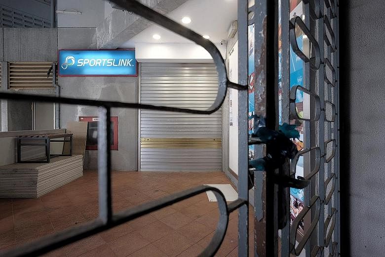 The Sportslink store at Ang Mo Kio Avenue 6 with its shutters down. The sports retail store has been served a winding-up application after accumulating debts to a "substantial number" of creditors. ST PHOTO: GAVIN FOO