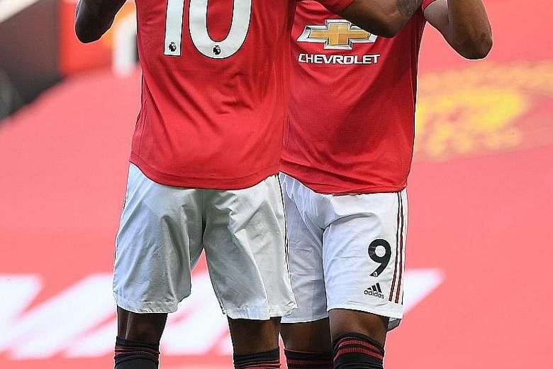 Anthony Martial celebrating with Marcus Rashford after scoring the first of his three goals in Manchester United's 3-0 victory over Sheffield United last month. The duo both scored in last weekend's 5-2 win over Bournemouth. PHOTO: EPA-EFE