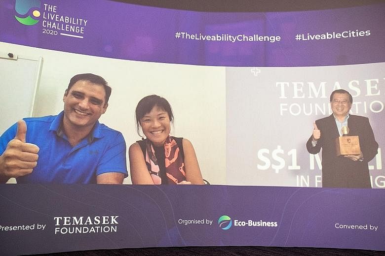 Singapore-based biotech start-up TurtleTree Labs co-founders Max Rye (far left) and Lin Fengru being congratulated by Temasek Foundation Ecosperity chief executive Lim Hock Chuan for winning the annual Liveability Challenge, a global platform which c