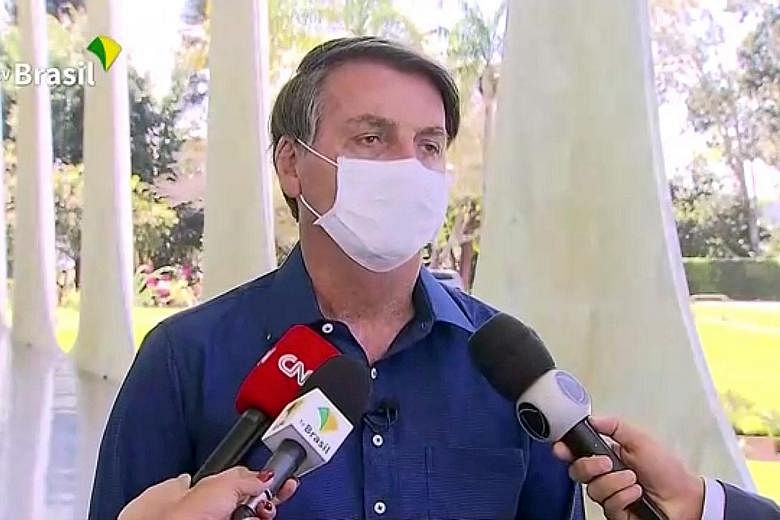 Brazilian President Jair Bolsonaro announcing on television on Tuesday that he was infected with the virus, adding that he felt "perfectly well". PHOTO: REUTERS