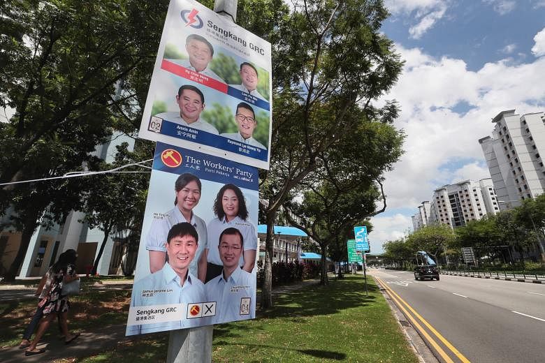 Posters of candidates from the People's Action Party and Workers' Party standing for election in Sengkang GRC line the streets in the constituency. Among the top issues on voters' minds this election are how they should vote amid the Covid-19 pandemi