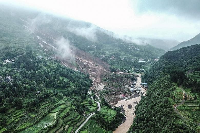 Heavy rain and landslides in China have left at least 14 people dead or missing since Wednesday, burying houses and causing scenic areas to close temporarily. Aerial footage on Wednesday showed a vast swathe of greenery replaced by mud in Songtao Mia