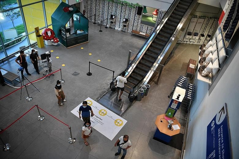Thermal scanners at Ikea Tampines to screen shoppers. Retailers report a mixed showing, with some stores seeing more shoppers, while others say traffic peaked in the first week of phase two. ST PHOTO: ARIFFIN JAMAR