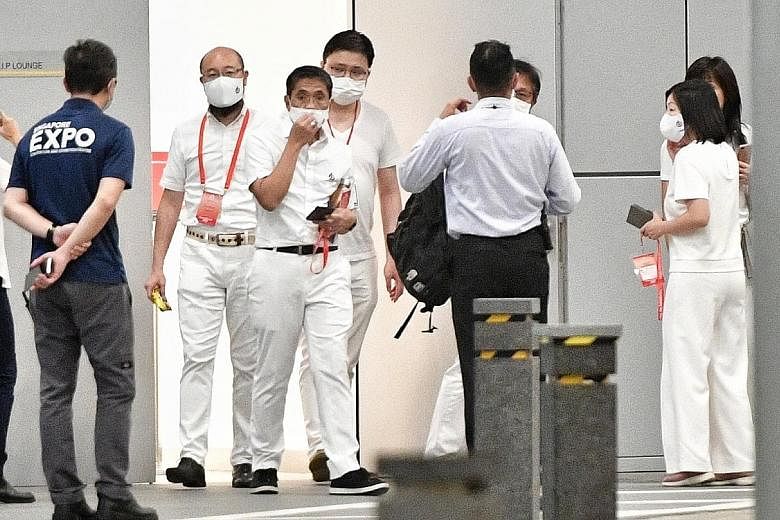 DPM Heng Swee Keat (above) and other members of the PAP's East Coast team, including Senior Minister of State Maliki Osman (second from left) and Ms Cheryl Chan (right) outside the Max Atria early this morning, where they waited for the election resu